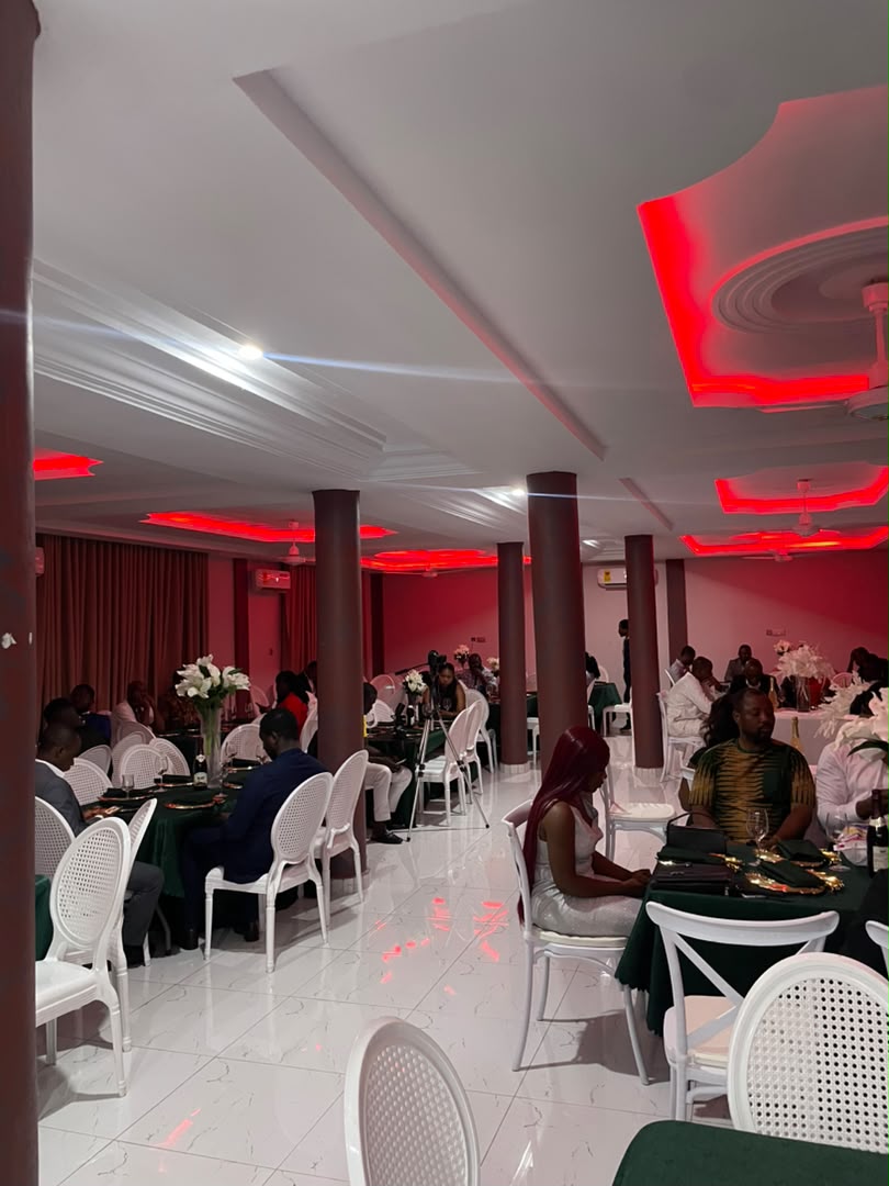 Abank Village conference room with pink mood lighting and guests