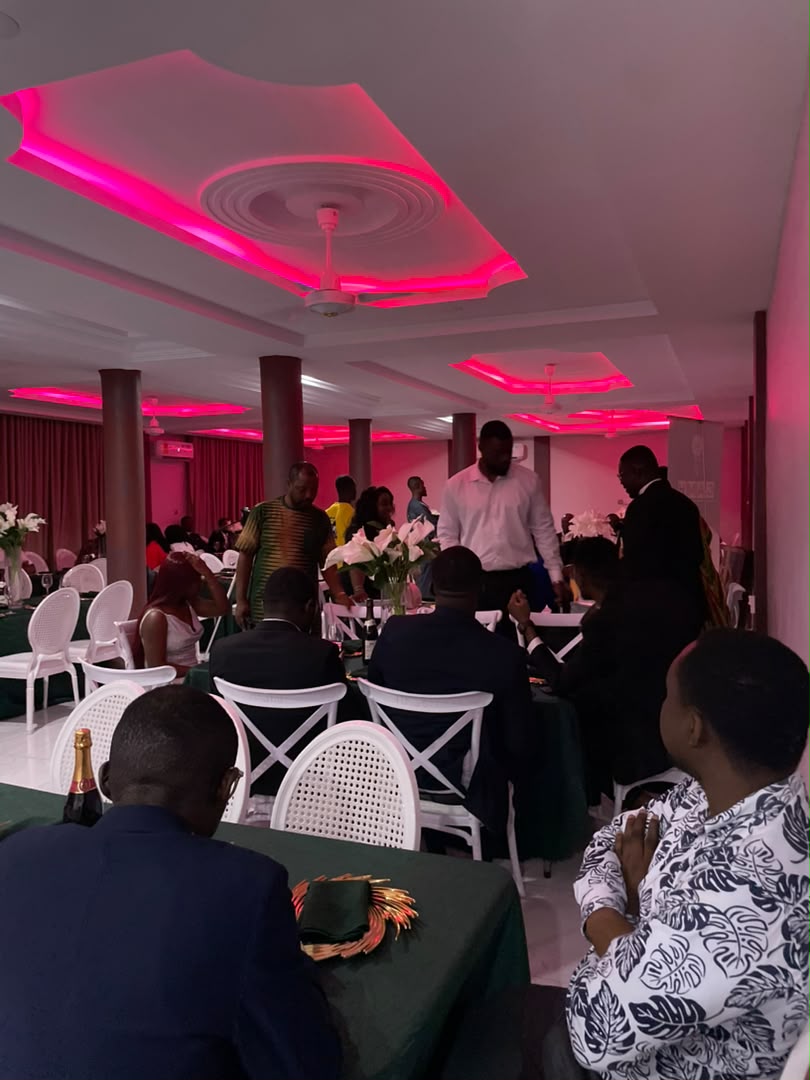 Abank Village conference room full house under red lighting